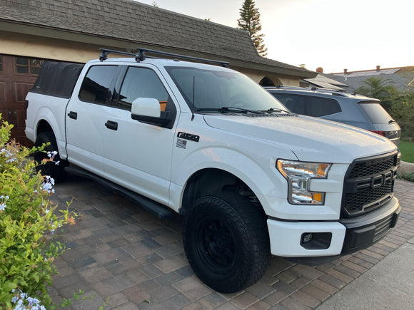White Ford truck parked on a driveway