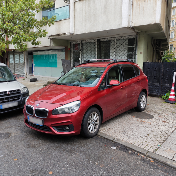 BMW 2 Series Active Tourer F45 2014-2021 with silver roof rack cross bars installed on flush integrated roof rails