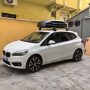 BMW 2 Series Active Tourer F45 2014-2021 silver roof rack cross bars fitted with vehicle-specific door-frame clamp mounting