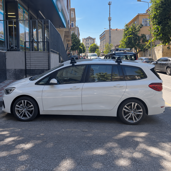BMW 2 Series Gran Tourer F46 2014-2021 black roof rack cross bars fitted with vehicle-specific door-frame clamp mounting