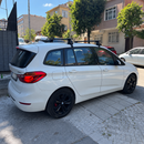 Vehicle fitment example of black normal roof cross bars on BMW 2 Series Gran Tourer F46 2014-2021 with no factory roof rails
