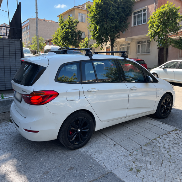 Vehicle fitment example of black normal roof cross bars on BMW 2 Series Gran Tourer F46 2014-2021 with no factory roof rails
