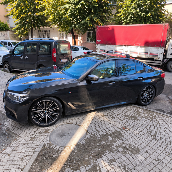 BMW 5 Series Sedan G30 2016-2023 with silver fix point roof rack cross bars installed