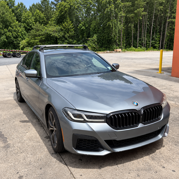 BMW 5 Series Sedan G30 2016-2023 silver roof rack cross bars fitted to factory fixed mounting points