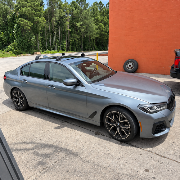 BMW 5 Series Sedan G30 2016-2023 silver roof rack cross bars fitted to factory fixed mounting points