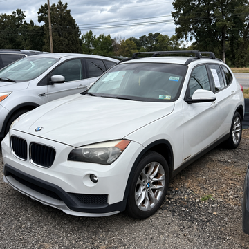 BMW X1 with flush rail roof rack cross bars installed