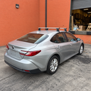 Vehicle-specific aluminum roof rack cross bars for normal roof vehicles