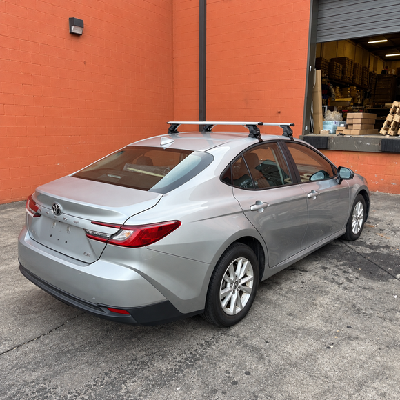 Vehicle-specific aluminum roof rack cross bars for normal roof vehicles