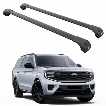 Two car roof racks on a white background with a Ford SUV below.