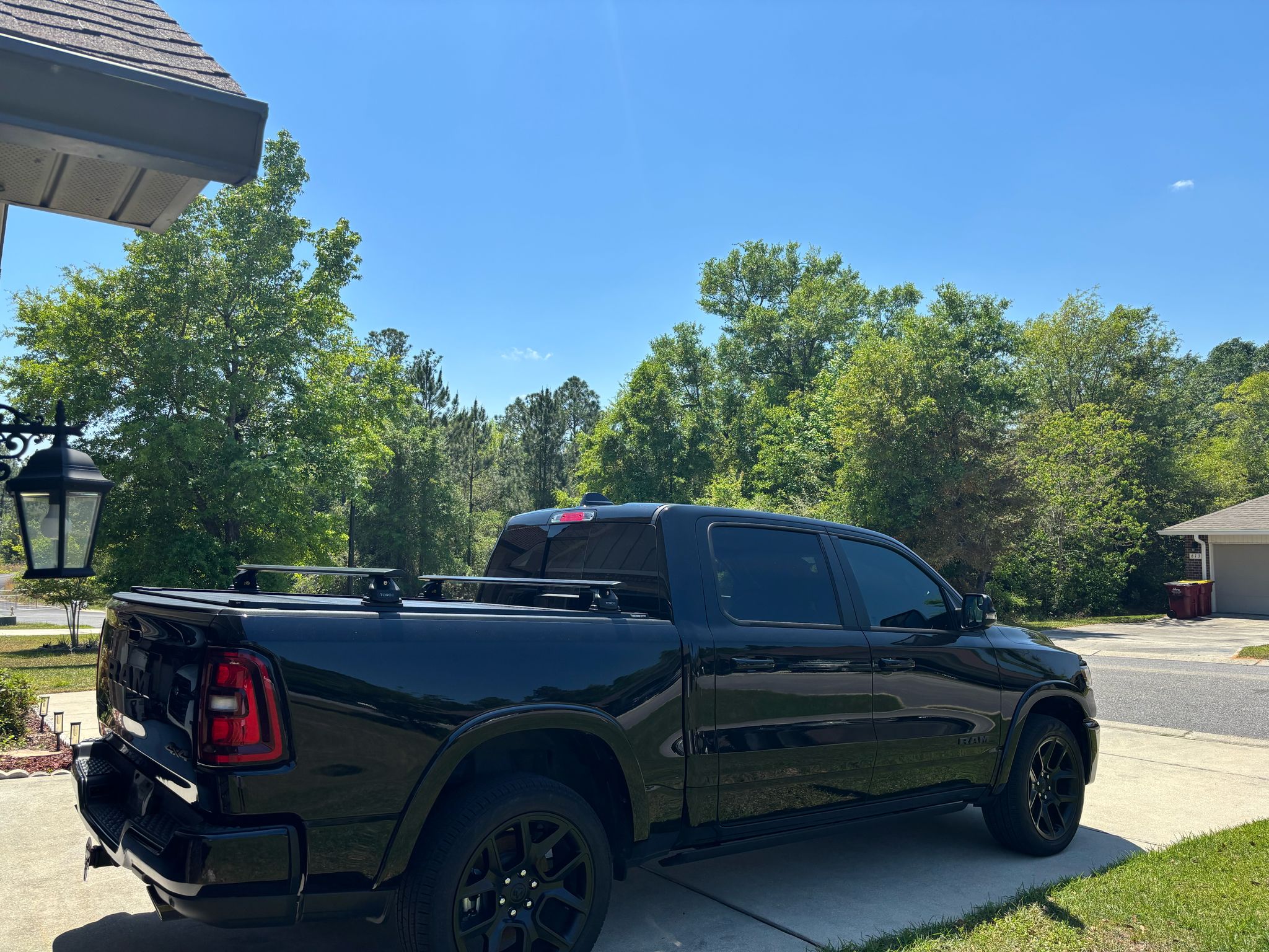For RAM 1500 (2009-2025) Bed Rack Cross Bars with Metal Brackets (Aluminum, Black) + RealTruck Tonneau Cover w/ T-Slot Rails