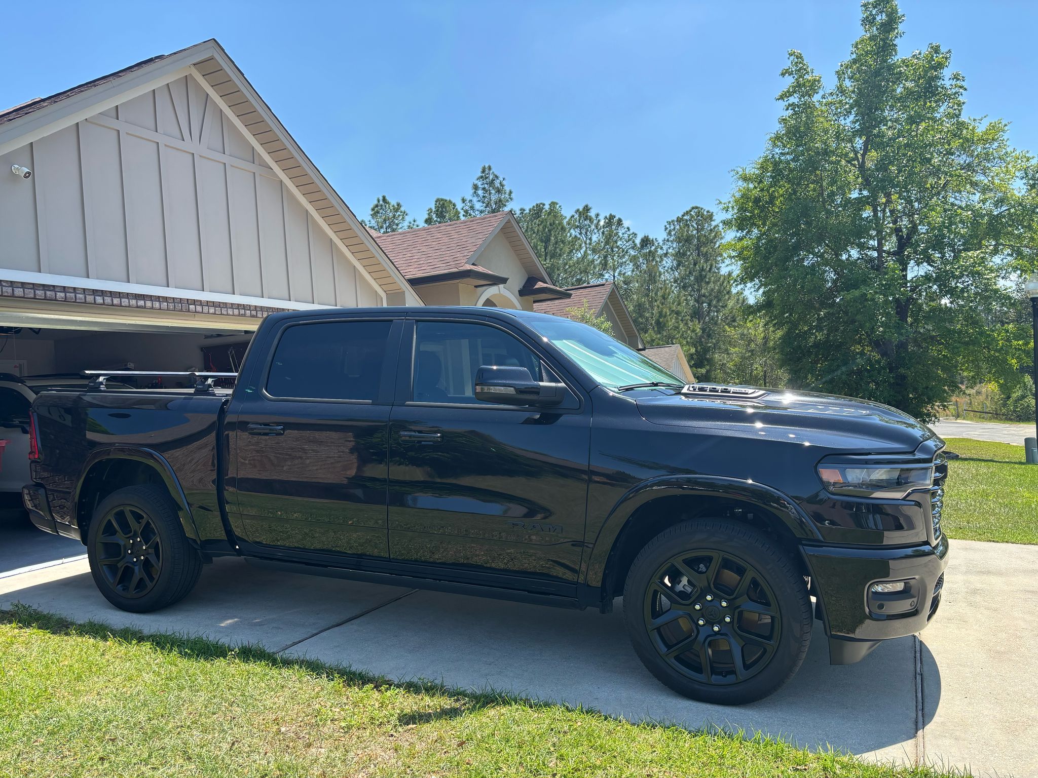 For RAM 1500 (2009-2025) Bed Rack Cross Bars with Metal Brackets (Aluminum, Black) + RealTruck Tonneau Cover w/ T-Slot Rails