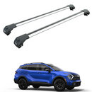 A pair of silver roof rack cross bars designed for a Kia Sportage, displayed above the vehicle which is a blue Kia Sportage SUV.